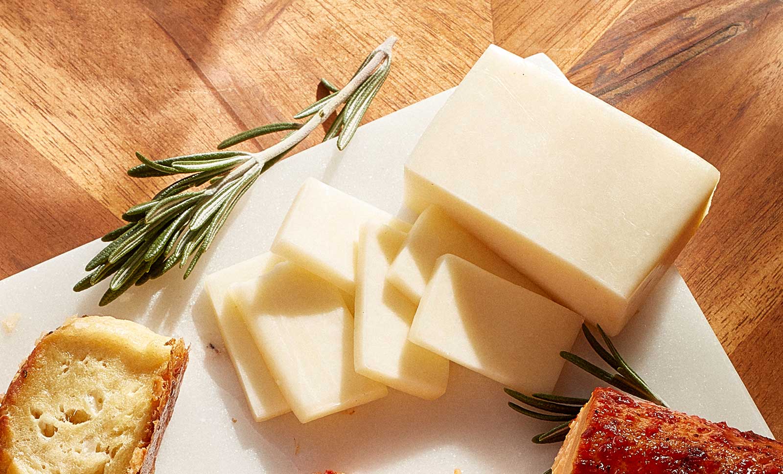 Monterey Jack Cheese with fresh herb garnish.