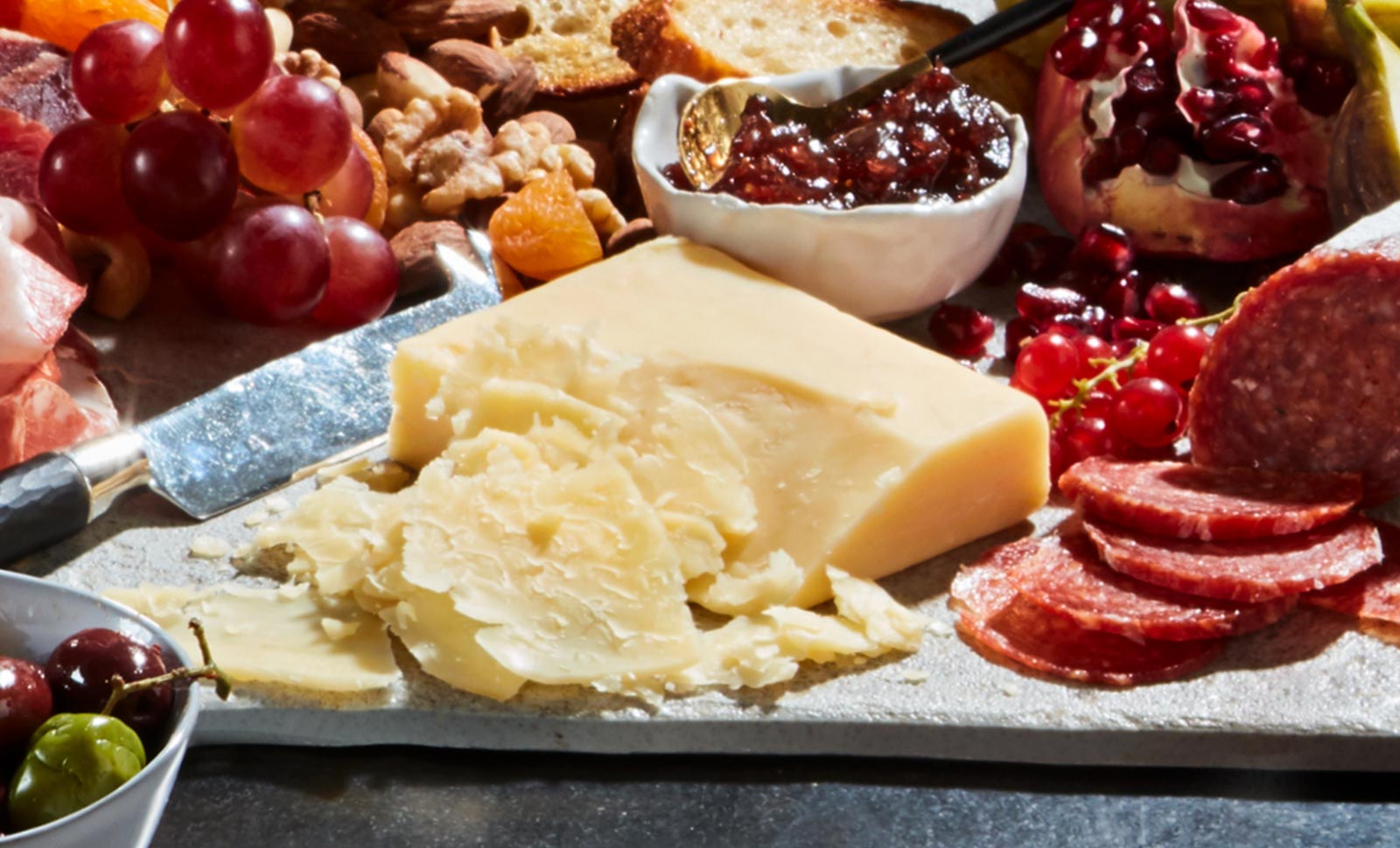 5 year aged cheddar with an assortment of fruits, nuts and sliced meats.
